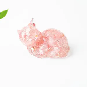 Closeup view of a cute pink crystal resin cat figurine, perfect desktop decor for home or office.