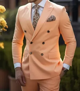 Detailed view of the elegant peach double breasted mens suit jacket with pattern pocket square.
