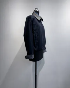 Moderna giacca corta da donna blu scuro con colletto contrastante zip dettaglio moda