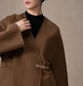 Detail view of women's cashmere wool wrap coat V-neck belted short outerwear fashion.