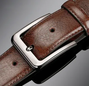 Men's brown leather belt detail shot with brushed metal buckle, retro business casual style.