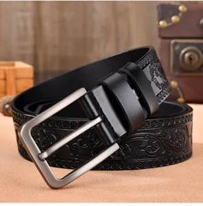 Men's leather belt detail view, vintage embossed design with metal pin buckle, close up texture