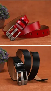 Detailed shot of genuine cowhide women belt with metal pin buckle in classic red and black.