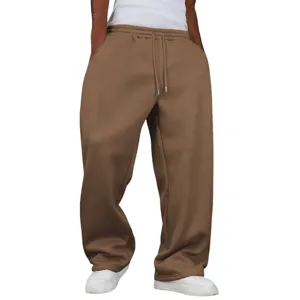 Detailed view of brown loose-fit wide-leg fleece-lined sweatpants showing elastic drawstring waist.