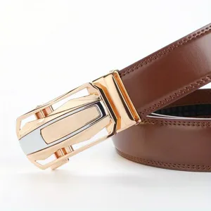 Close-up detail of stylish brown leather men's belt with modern gold automatic buckle.
