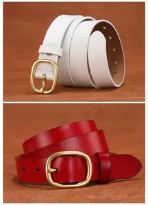 Detailed close-up of women's genuine leather belt featuring elegant metal pin buckle. Stylish design.
