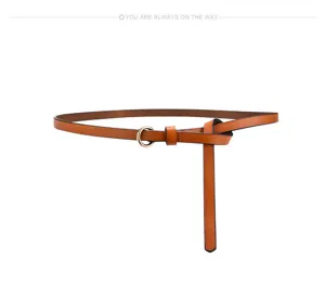 Detail shot of the stylish brown thin leather belt with metal ring buckle and elegant knot.