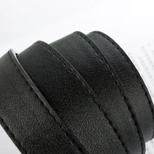 Close-up detail of black leather belt with neat double stitching, premium texture and elegant style.