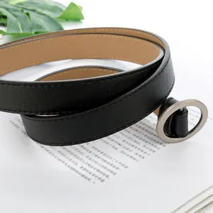 Minimalist black leather belt for women featuring a sleek silver round metal buckle detail.
