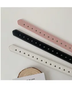 Hollow out heart design women belt detail view, minimalist style PU leather jeans belt.
