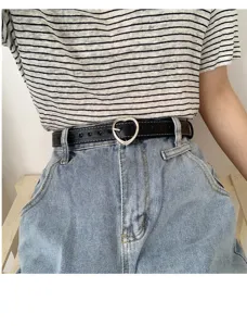 Women's black leather belt with silver heart buckle and cute hollow out design for jeans.