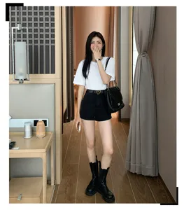 Stylish women heart buckle belt detailed shot, minimalist design for jeans and dresses.