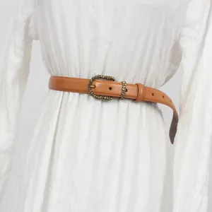 Brown leather belt for women featuring a vintage metal buckle and classic chic design.