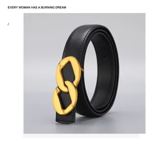 Closeup of women black leather belt with gold chain buckle, retro design detail.