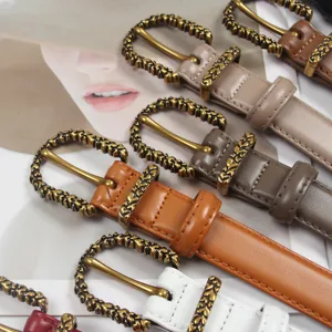 Stylish women's leather belt featuring vintage carved metal buckle, perfect chic waist accessory.