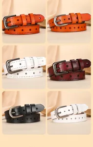 Detailed view of women's genuine leather belt featuring star cutouts and metal buckle.