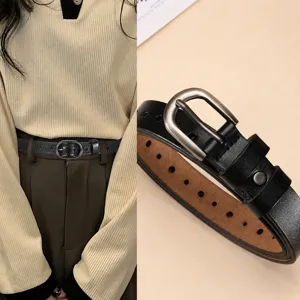 Women black leather belt with metal pin buckle and star embossed design for casual wear.