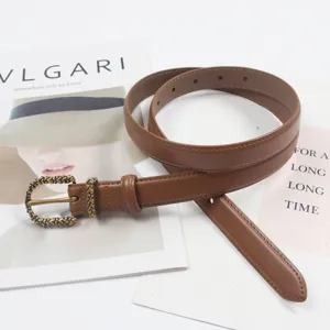 Slim genuine leather belt for women featuring a vintage metal buckle, versatile jeans accessory.