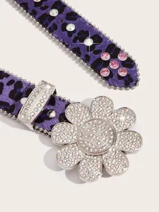 Close-up of the crystal rhinestone sunflower buckle and purple leopard print belt strap.