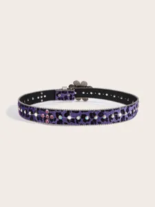 Close-up of purple leopard print rhinestone belt with crystal details and flower buckle.