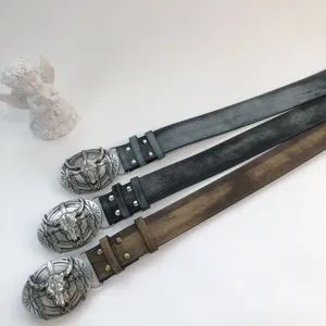 Western vintage women belt with bull skull metal buckle, stylish leather waistband for jeans.