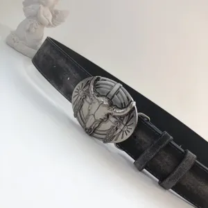 Western vintage black leather belt featuring detailed steer skull metal buckle style.