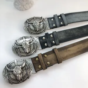Vintage western cowboy leather belt with bull skull metal buckle for unisex use.