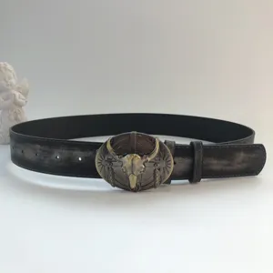 Vintage bull skull buckle black leather belt, retro waist decoration for jeans and casual wear.