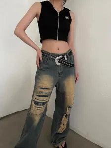 Detail view of a stylish rhinestone star studded belt paired with distressed denim.