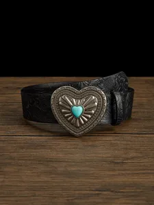 Detailed view of vintage black leather belt with ornate heart buckle and turquoise stone.