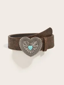 Close-up view of the vintage embossed brown leather belt with turquoise heart buckle.