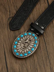 Western style embossed leather belt with retro turquoise buckle and cross horse motif.
