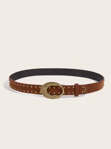 Close-up detail of brown suede belt featuring antique bronze oval buckle and metal studs.