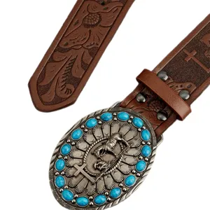 Western style embossed leather belt with vintage turquoise buckle and cowboy cross relief.