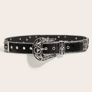 Western rhinestone cowboy belt with croc-embossed leather and ornate silver metal buckle.