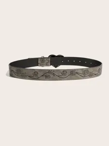 Close-up of vintage grey textured belt featuring delicate floral vine print and a chic heart buckle.