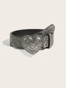 Close-up of vintage grey textured leather belt with embossed metal heart buckle and floral print.