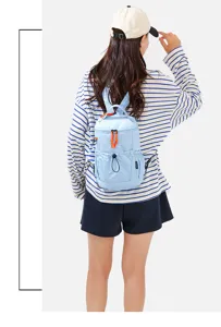 Light blue mini backpack casual travel daypack with orange zipper details for daily use