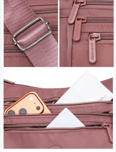 Nylon Umhängetasche Detailansicht mit mehreren Reißverschlussfächern und verstellbarem Gurt.