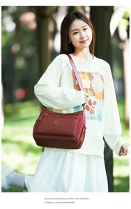 Leichte Nylon Umhängetasche für Damen, lässige, vielseitige Crossover Tasche mit mehreren Fächern.