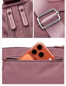 Detailansicht der Damen Nylon Freizeittasche mit Metallreißverschluss und verstellbarem Gurt.