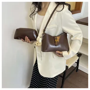Chic brown PU leather underarm shoulder bag with cute bear charm for daily commuting style.