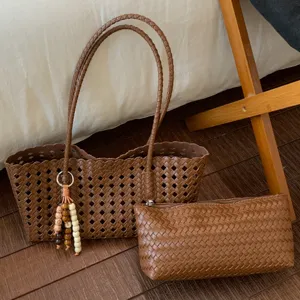 Stylish brown woven tote bag set with matching pouch and bead charm for women daily commute.