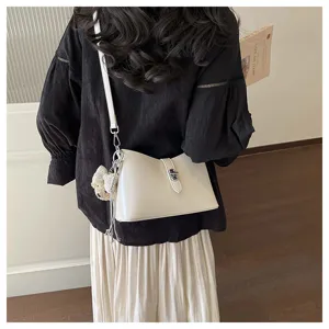 Minimalist white shoulder bag for women, stylish commuting crossbody bag with chic metal lock.