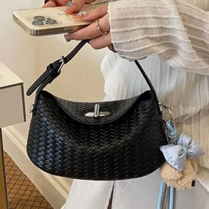 Black woven underarm shoulder bag for women, retro chic handbag with metal lock and charm.