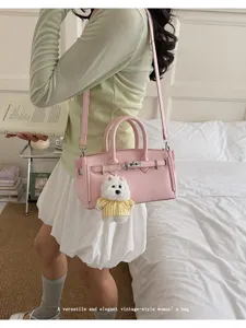 Pink litchi texture women handbag, vintage style shoulder crossbody bag with cute dog pendant.