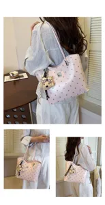 Stylish pink polka dot tote bag for women, large capacity shoulder bag for daily commute.