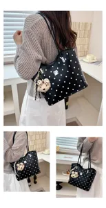 Stylish black polka dot shoulder tote bag for women, large capacity daily commuting bag.