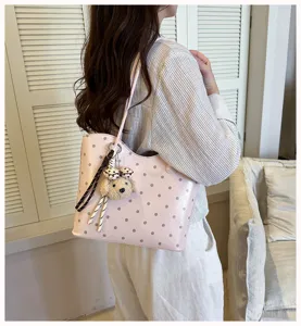 Pink polka dot shoulder tote bag for women, large capacity commuter bag with cute bear pendant.