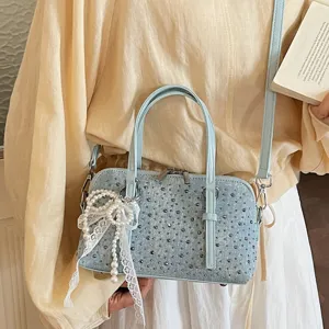 Fashion denim handbag with rhinestones and pearl bow, chic shoulder and crossbody bowling bag.